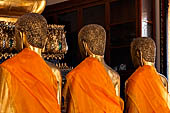 Bangkok Wat Pho, the southern wihan, one of the four side chapels around the ubosot. Disciples seated in front the Buddha statue called Buddha Chinnaraja. 